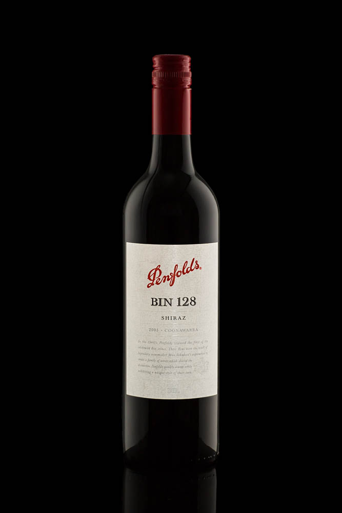 product photography of penfolds shiraz wine bottle on black background